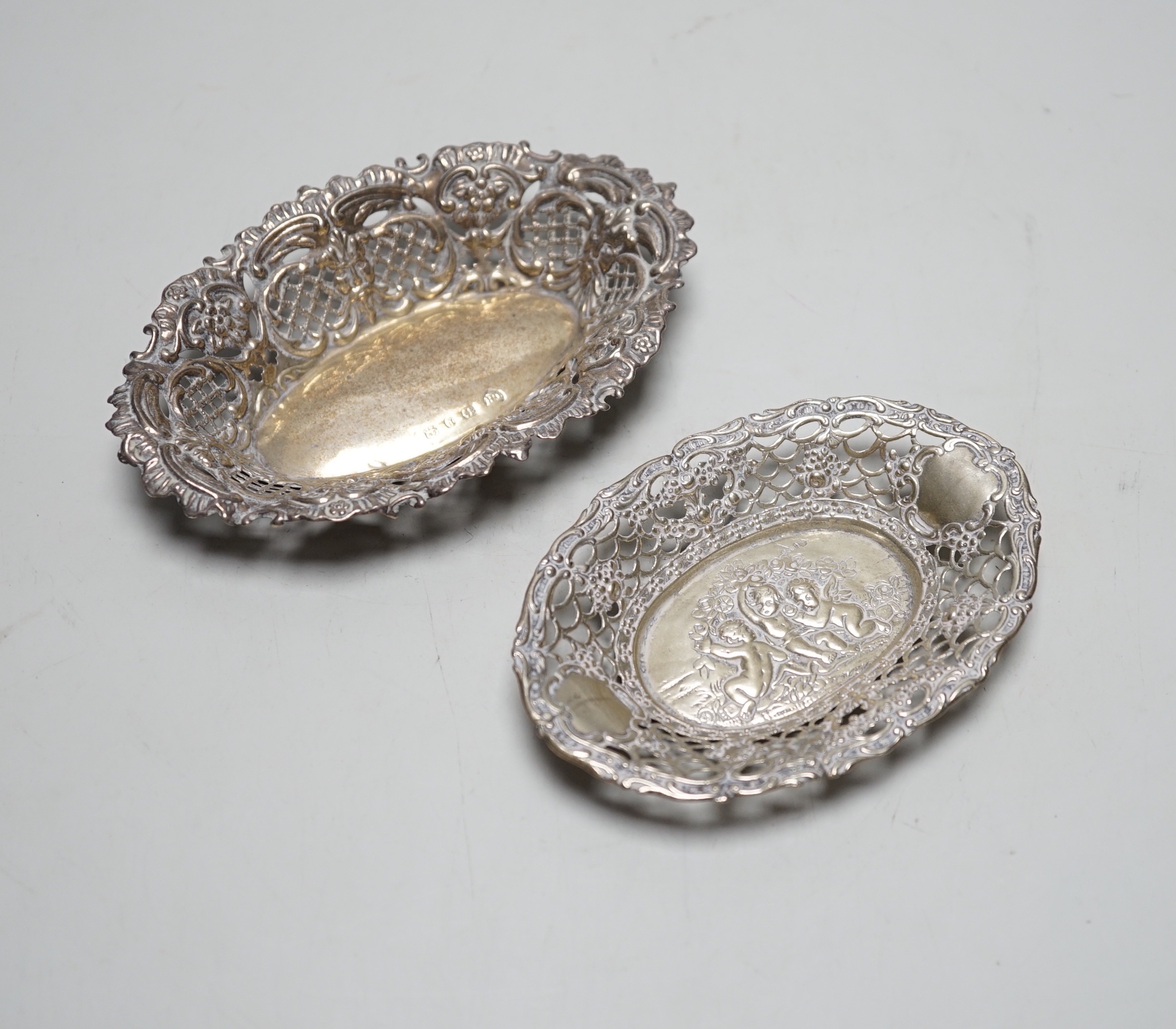 Two small oval pieced silver bonbon dishes, Birmingham, 1898, 13cm and smaller German 800 standard.